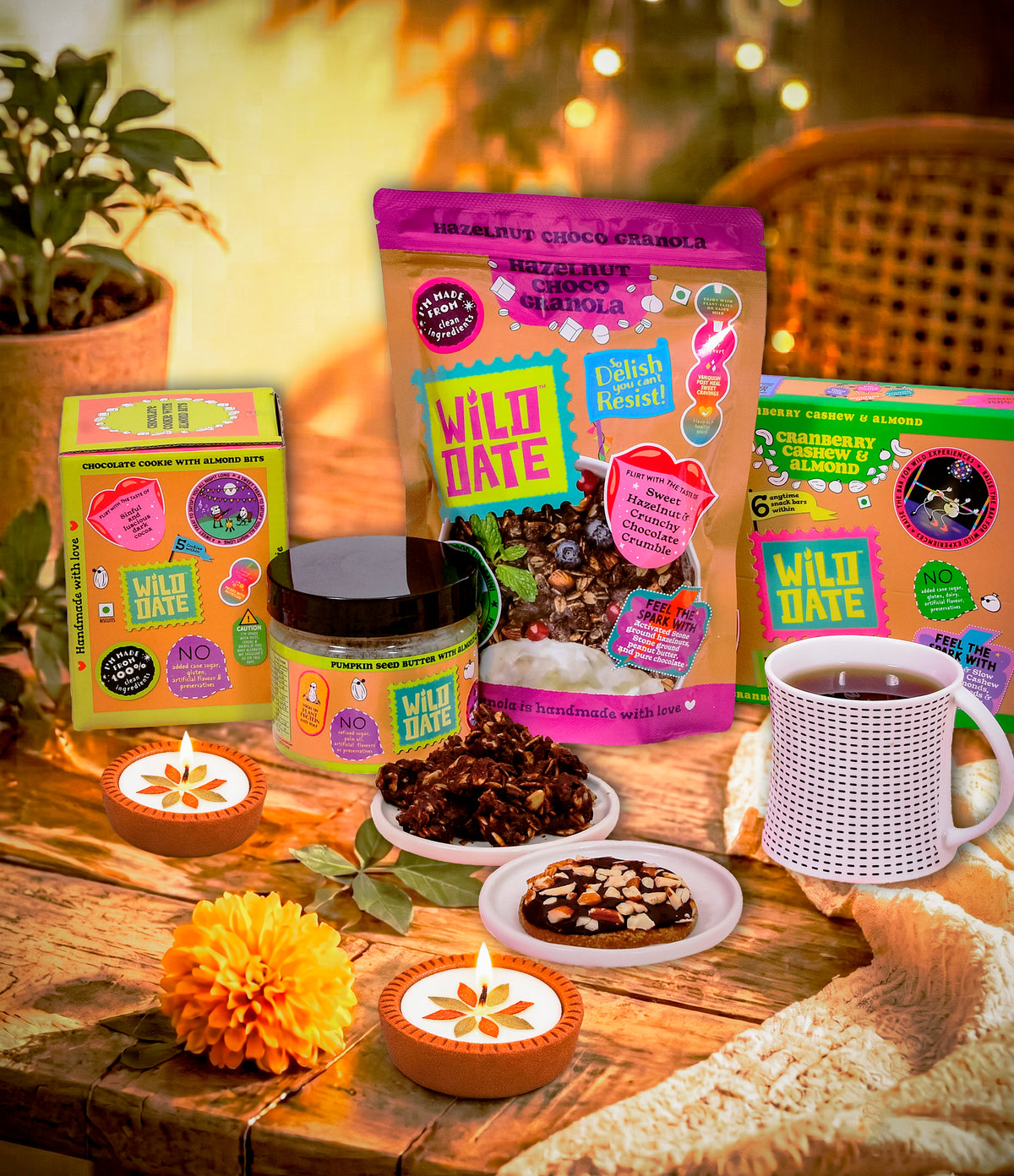 Wild Date Big Diwali Gift Hamper - Gluten-Free |Plant Protein-Rich Snacks | Hazelnut Chocolate Granola, Chocolate Cookie with Almond Bits, Cranberry, Cashew & Almond Bars, Pumpkin Seed Butter with Almond Crunch, Festive Diyas & Premium Tea